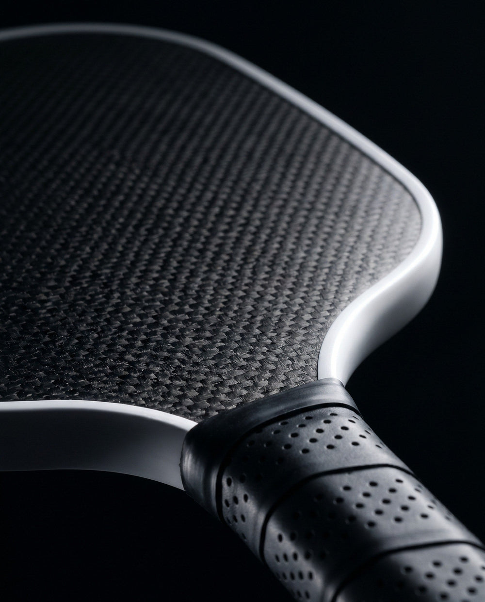 Close-up of a pickleball paddle edge and surface texture