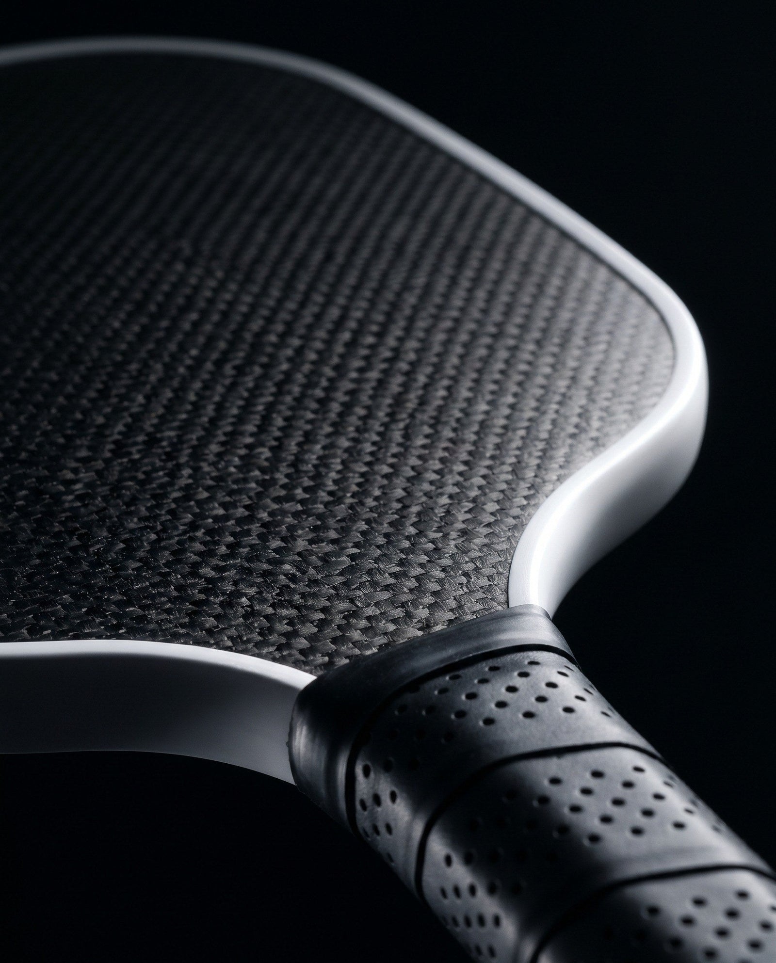 Close-up of a pickleball paddle edge and surface texture