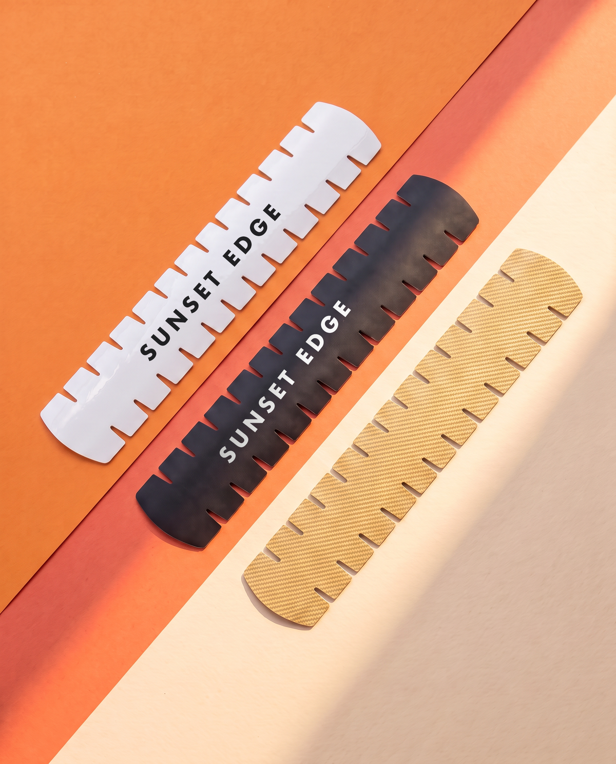 Slotted frame protectors: flat gloss white and matte black, raised carbon gold