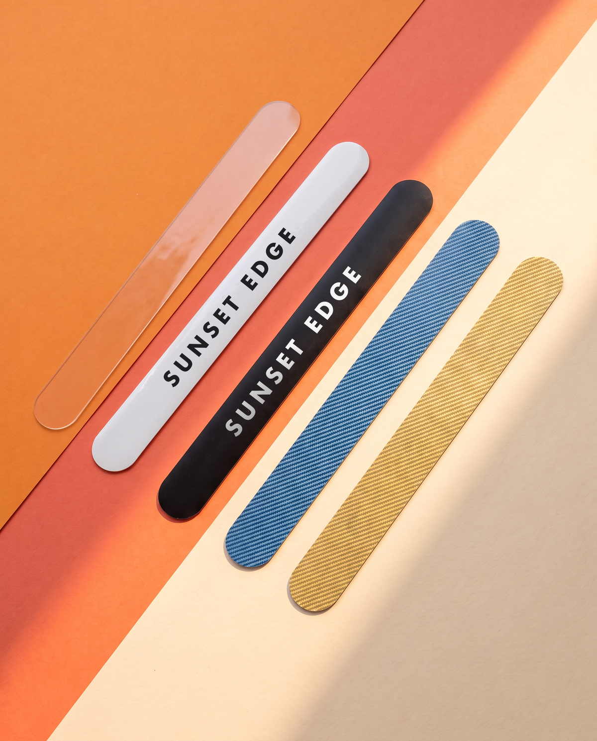 Straight frame protectors: flat clear, gloss white and matte black, raised carbon blue and carbon gold